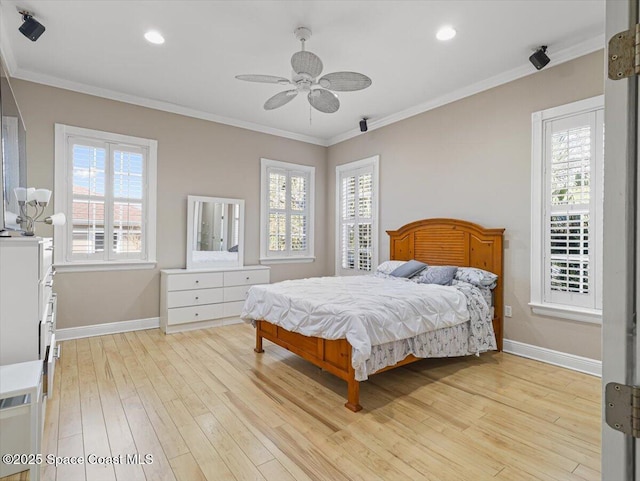 bedroom featuring ceiling fan, light hardwood / wood-style floors, and ornamental molding