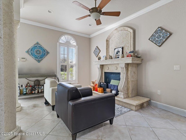 tiled living room featuring crown molding, a fireplace, and ceiling fan