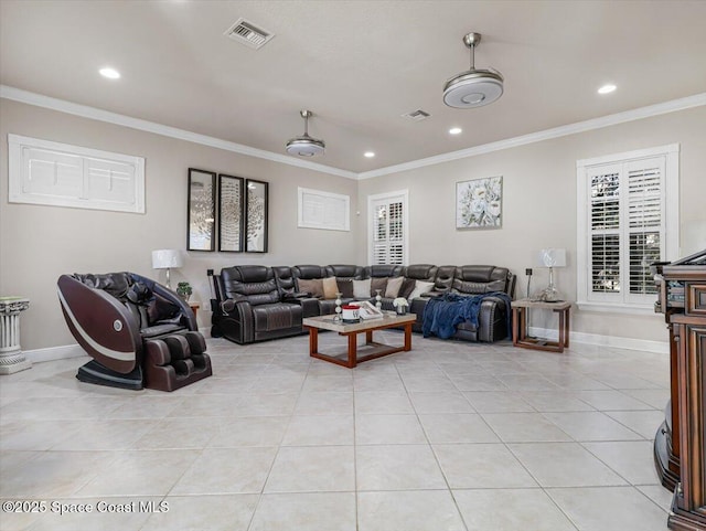 living room with light tile patterned floors and ornamental molding