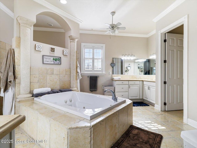 bathroom with vanity, ceiling fan, ornate columns, ornamental molding, and tiled bath