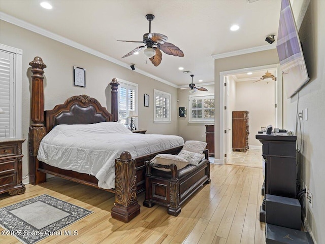 bedroom with ceiling fan, light hardwood / wood-style floors, and crown molding