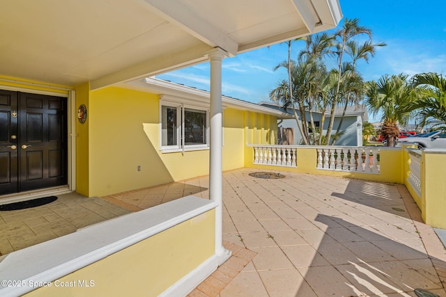 view of patio featuring a porch