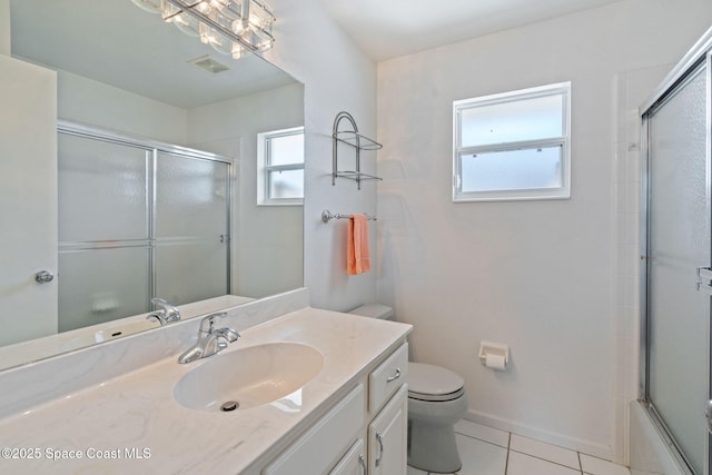 bathroom featuring visible vents, toilet, enclosed tub / shower combo, tile patterned flooring, and vanity