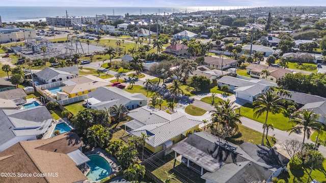 drone / aerial view with a residential view and a water view