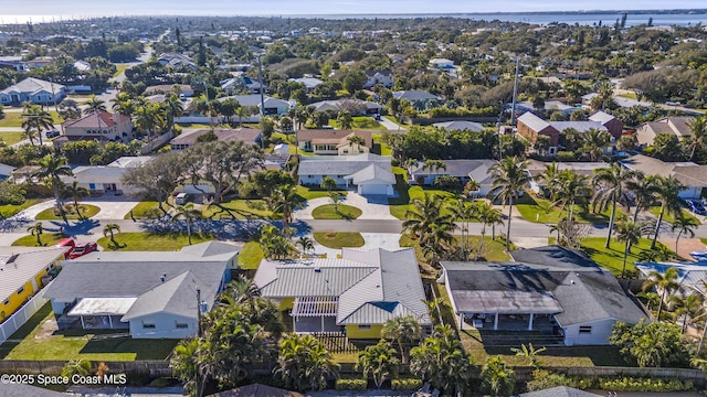 birds eye view of property with a residential view