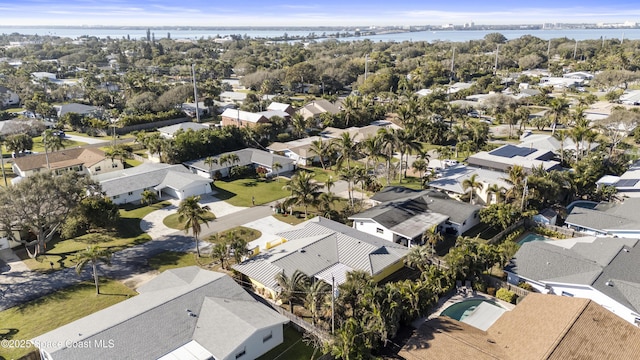 drone / aerial view with a residential view and a water view