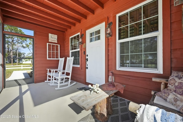 property entrance with covered porch