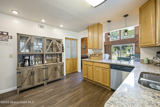 kitchen featuring dishwasher, dark hardwood / wood-style floors, decorative light fixtures, light stone counters, and kitchen peninsula