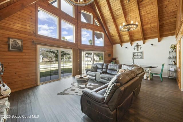 living room with dark hardwood / wood-style flooring, beamed ceiling, high vaulted ceiling, a chandelier, and wood ceiling