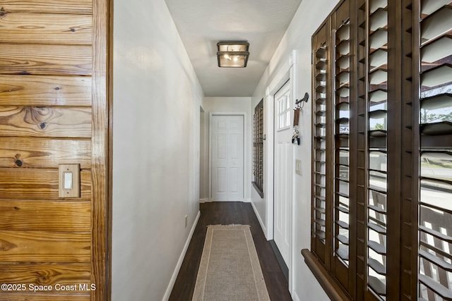 corridor featuring dark hardwood / wood-style flooring