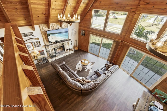 living room with wooden ceiling, beamed ceiling, high vaulted ceiling, a fireplace, and hardwood / wood-style flooring