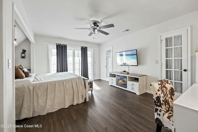 bedroom with ceiling fan and dark wood-type flooring