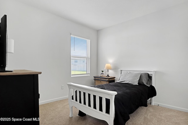 bedroom with light colored carpet