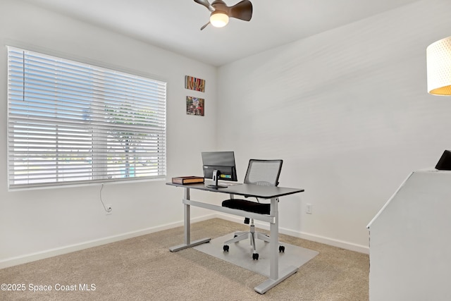 carpeted office featuring ceiling fan and plenty of natural light