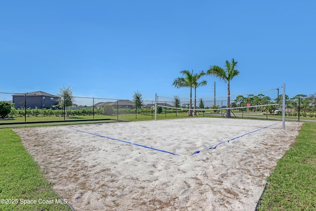 surrounding community featuring volleyball court and a lawn