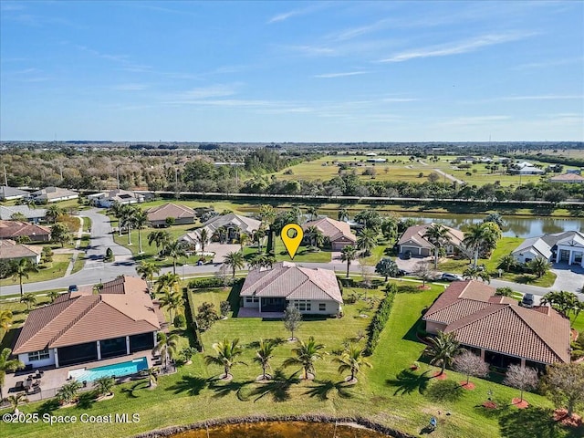 birds eye view of property featuring a water view