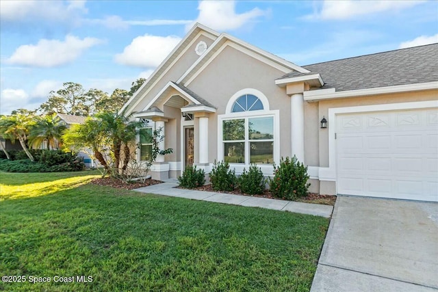 view of front of house with a garage and a front lawn