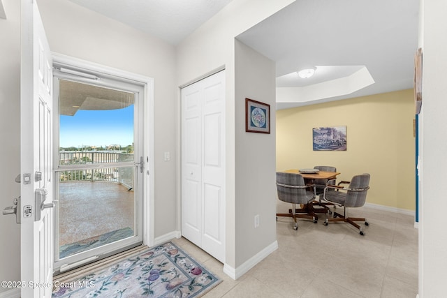 entrance foyer featuring light tile patterned floors