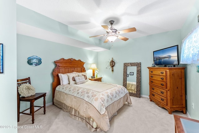 bedroom featuring light carpet and ceiling fan