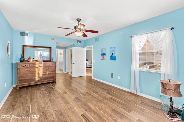 bedroom with ceiling fan and light wood-type flooring