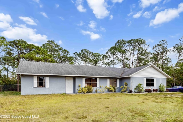 single story home featuring a front yard