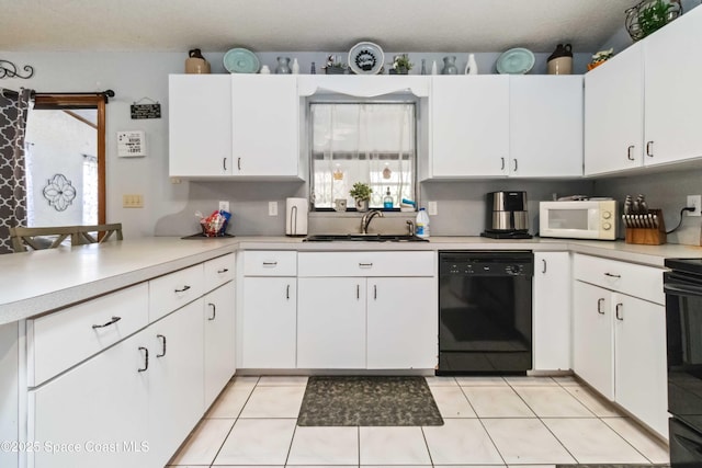 kitchen with electric range oven, dishwasher, white cabinetry, sink, and light tile patterned floors