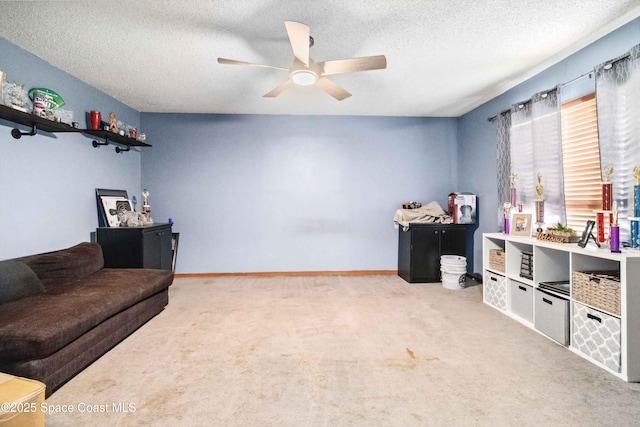 interior space featuring ceiling fan and a textured ceiling