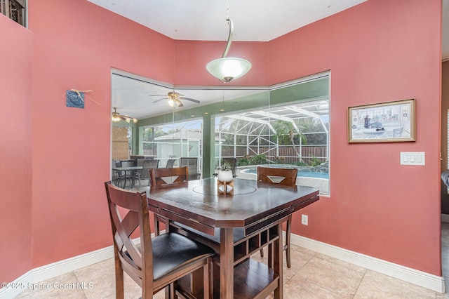 tiled dining space featuring plenty of natural light