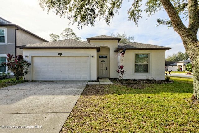 view of front of home with a garage and a front yard