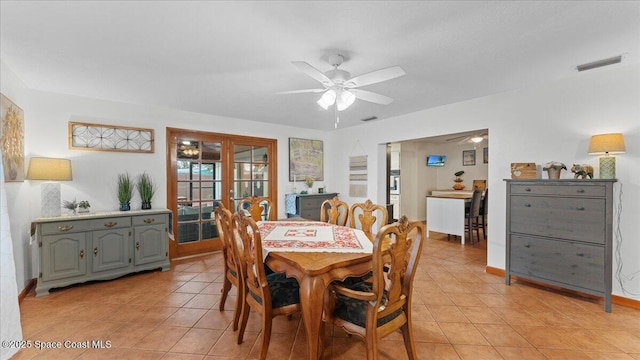 dining room with ceiling fan and light tile patterned floors