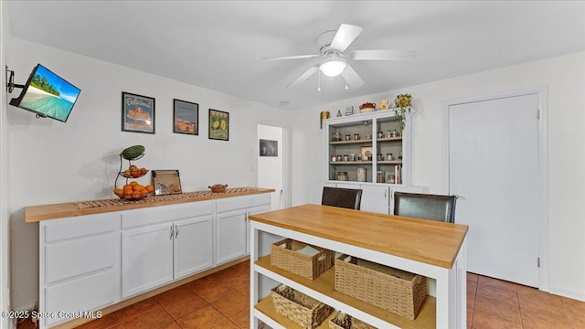 dining room with ceiling fan and light tile patterned flooring