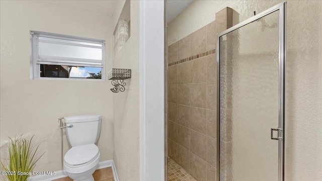 bathroom with toilet and walk in shower