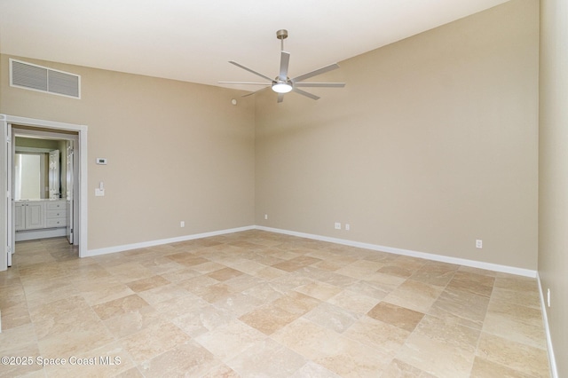 unfurnished room featuring lofted ceiling and ceiling fan