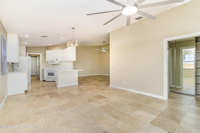 kitchen with white appliances, pendant lighting, white cabinetry, and ceiling fan