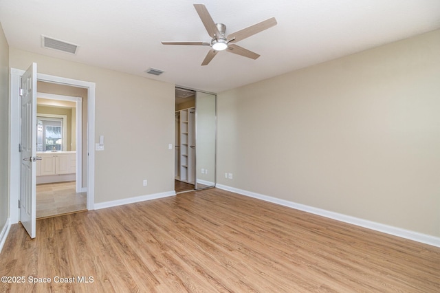 unfurnished bedroom featuring a closet, ceiling fan, and light hardwood / wood-style flooring