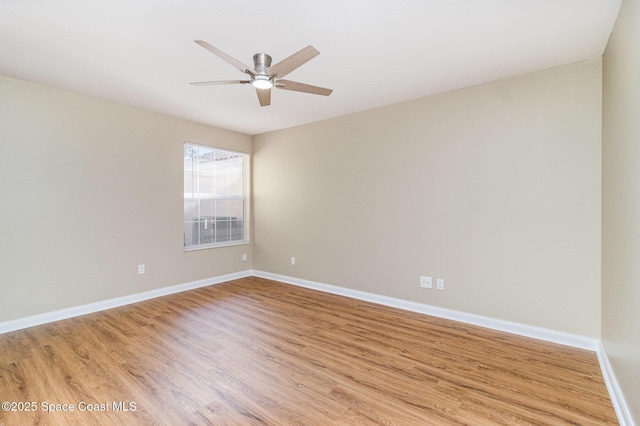 spare room featuring ceiling fan and light hardwood / wood-style flooring