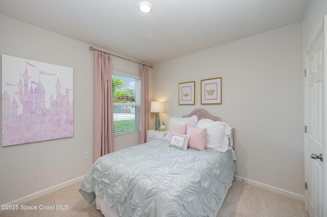 bedroom with light carpet