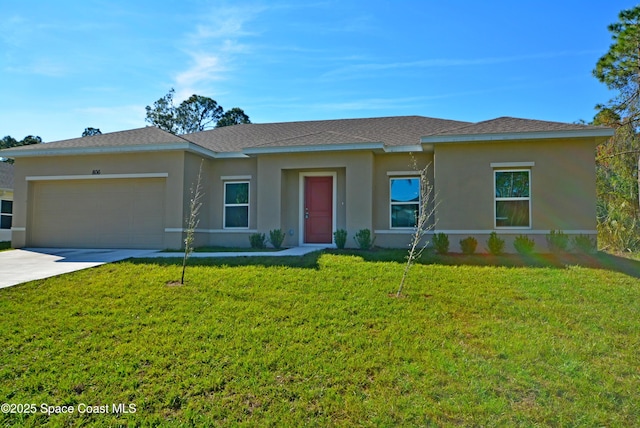 view of front of home with a front yard and a garage