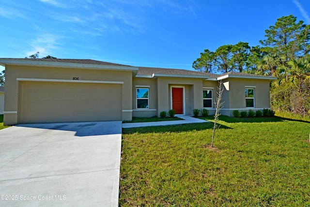 view of front of house with a garage and a front lawn