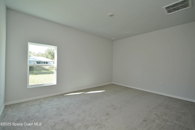 unfurnished room with carpet floors