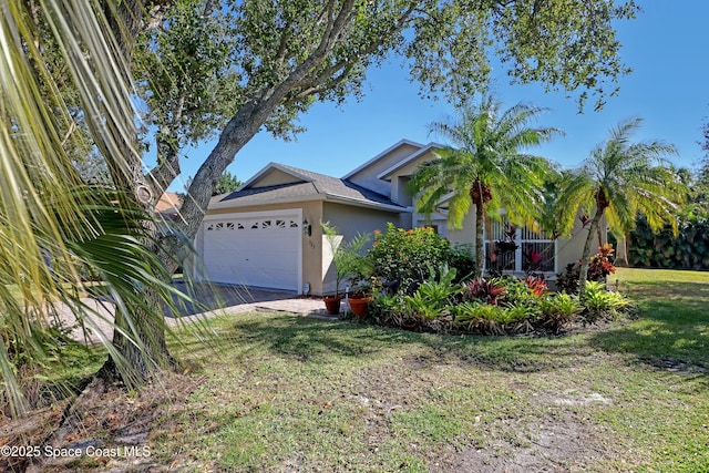 ranch-style house with a front lawn and a garage