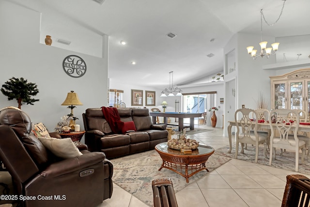 tiled living room with lofted ceiling and a notable chandelier