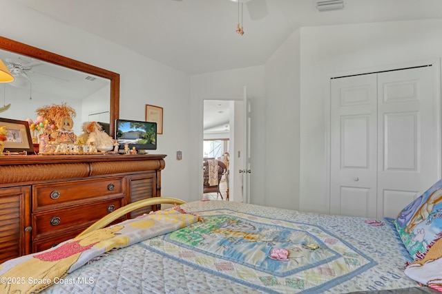 bedroom with a closet, ceiling fan, and lofted ceiling