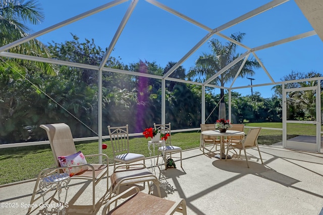 view of patio / terrace with a lanai