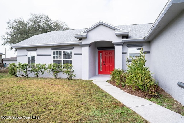 view of front of property with a front lawn