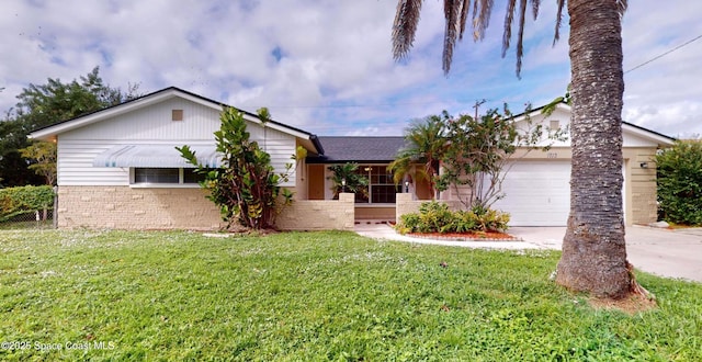 view of front of house featuring a garage and a front lawn