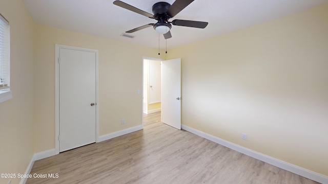 unfurnished bedroom featuring ceiling fan and light wood-type flooring