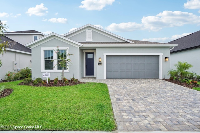 ranch-style home featuring a garage and a front lawn