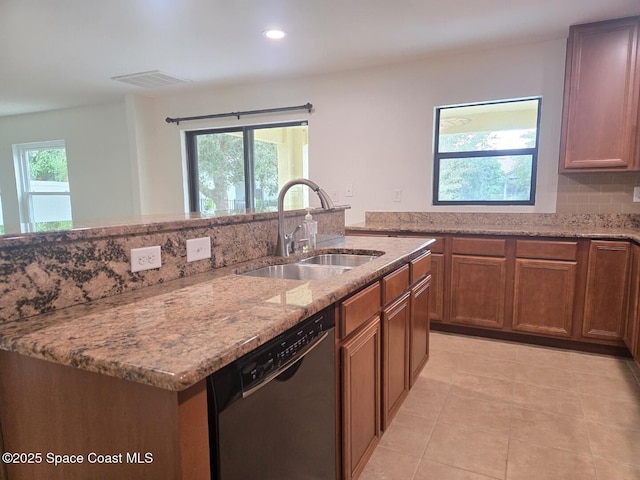 kitchen with dishwasher, decorative backsplash, a healthy amount of sunlight, and sink