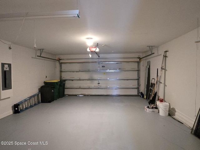 garage with electric panel and a garage door opener